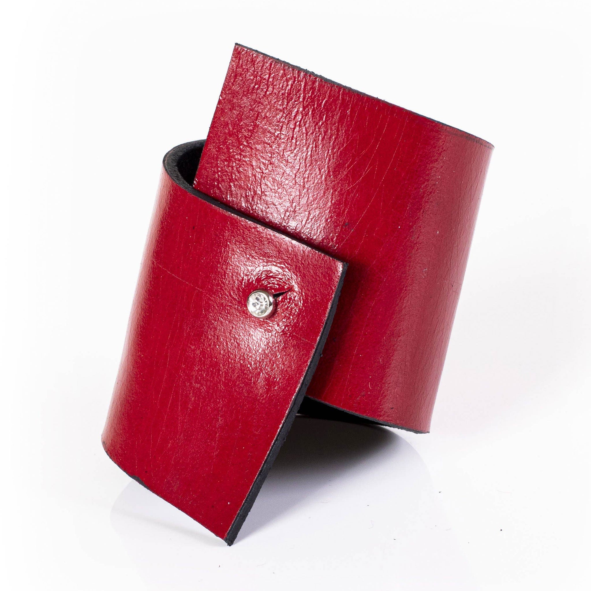 Premium leather wrist cuff bracelet asymmetrical rhinestone clasp punch-through unique angular modern fashion-forward artisinal handcrafted edgy arm gear accessories red