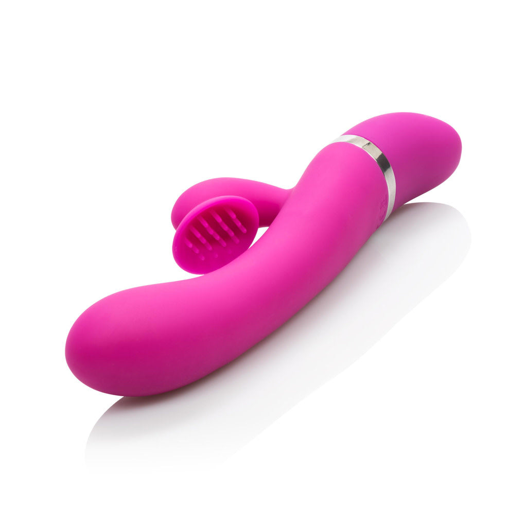 Foreplay Frenzy Climaxer Silicone Rabbit Vibrator in fuchsia with an erotically contoured design, dual motors, 12 functions, and a curved G-spot tip. Waterproof and easy-to-clean.