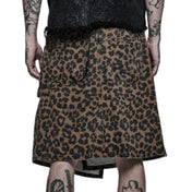 Cotton polyester PVC vinyl metallic-grommets apparel bottoms kilt knee-length wraparound wrap-around asymmetrical-hem pockets back-pockets waist-pockets leg-pocket pocket-flap studded stud studs dome-stud round-stud D-ring belt adjustable buckle press-studs snap-buttons front-closure pet pet-play leopard cheetah jungle-cat costume cosplay halloween caveman barbarian back-to-school back-2-school male masculine masc mens guys dudes brown leopard-print animal-print 