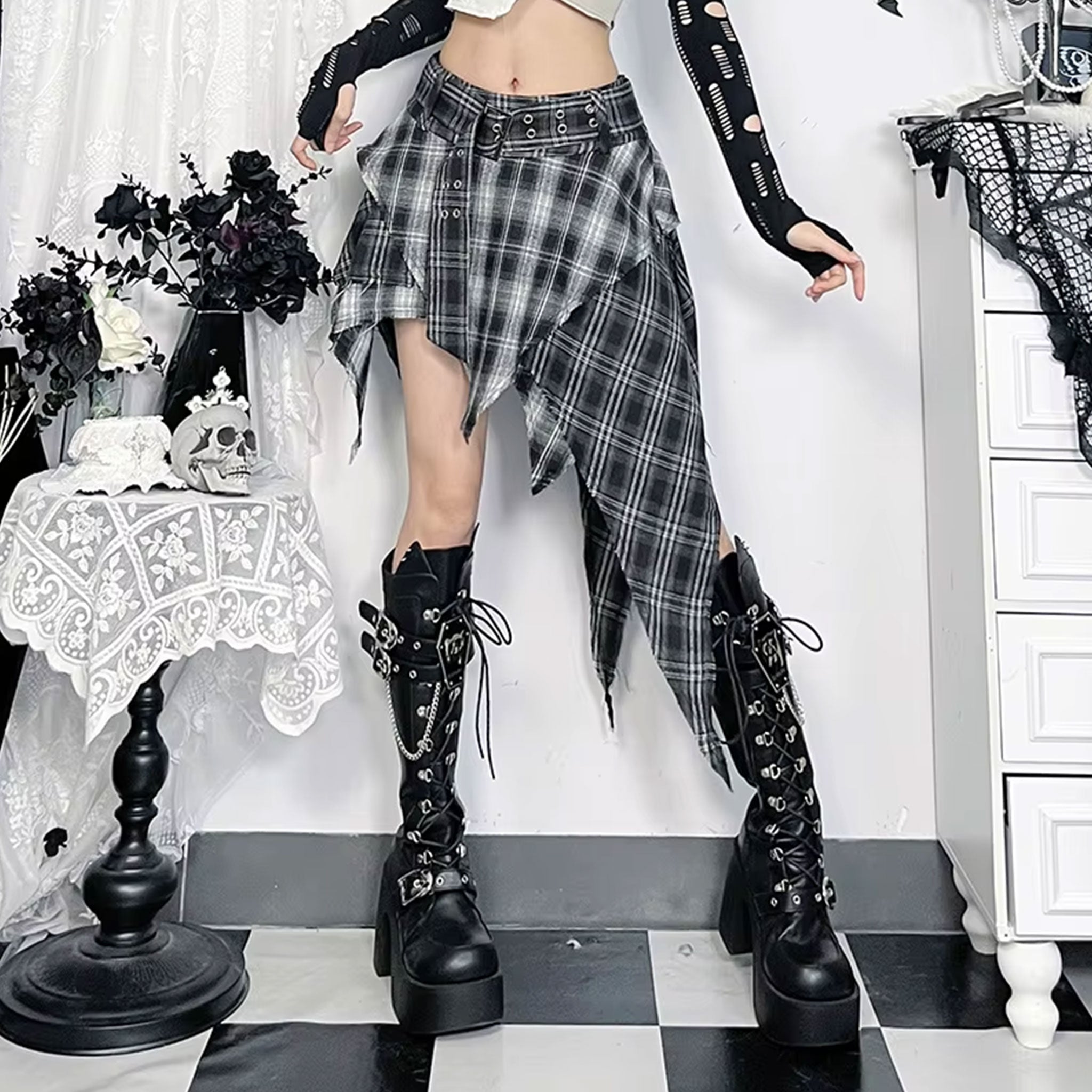 Cotton polyester apparel bottoms skirt miniskirt mini-skirt pleated-skirt asymmetrical-hem rough-edge frayed-edges zipper waistband-zip adjustable buckle wide-belt double-eyelet belt-loops soft rebellious trendy bold stylish unique fetish fashion alt-fashion alternative punk rock goth gothic gothic-inspired kink kinky kinkwear roleplay role-play uniform schoolgirl ageplay ddlg costume cosplay halloween back-to-school back-2-school female femme feminine womens tartan plaid black
