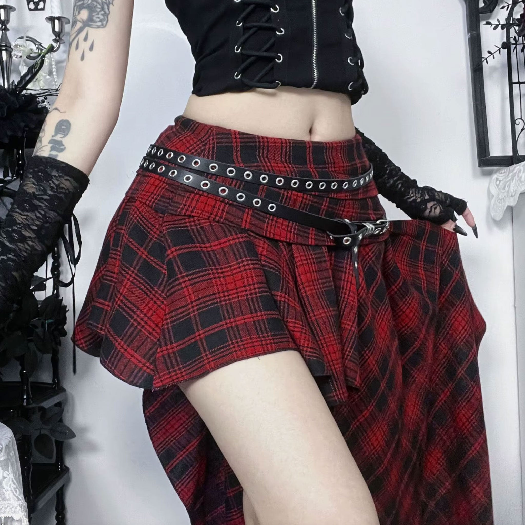 Polyester cotton leather vegan-leather apparel skirt midi-skirt mini-skirt asymmetrical bodycon zipper waistband-zip leather-belt adjustable buckle stylish trendy edgy unique stretchy comfortable fashion alt-fashion alternative punk goth gothic casual festival kink kinky kinkwear roleplay role-play uniform schoolgirl back-to-school back-2-school costume cosplay halloween female femme feminine womens tartan plaid red