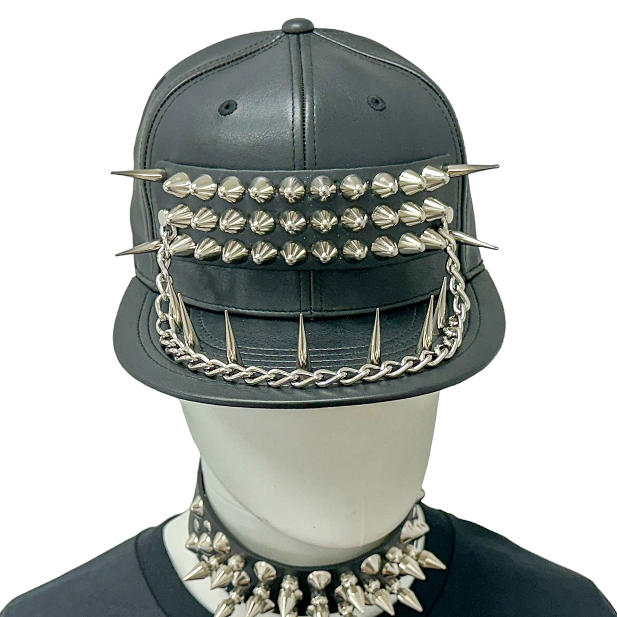 Polyester leather vegan-leather faux-leather metallic-chain accessories headgear hat baseball-hat cap baseball-cap spike spikes spiked hanging-chain pyramid-spikes stiletto-spikes spiked-bill adjustable buckle back-closure sleek edgy fetish fashion alt-fashion alternative goth gothic punk cyber cyberpunk streetwear athleisure casual concert festivalwear kink kinky kinkwear unisex black