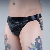 Latex premium-latex etched-pattern ectched-print intimates lingerie underwear jockstrap jock-strap pullon pull-on circuit circuit-print bold sleek stylish supportive striking edgy electrifying fetish fetishwear fashion alt-fashion bdsm bdsm-gear kink kinky male masculine masc mens menswear guys dudes black