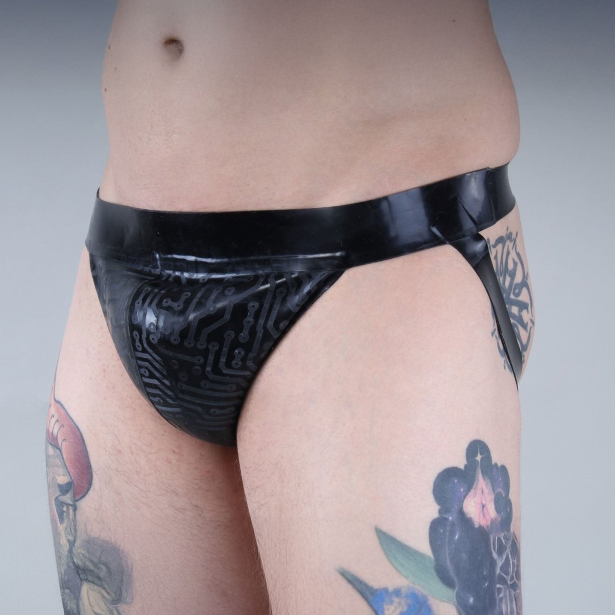 Latex premium-latex etched-pattern ectched-print intimates lingerie underwear jockstrap jock-strap pullon pull-on circuit circuit-print bold sleek stylish supportive striking edgy electrifying fetish fetishwear fashion alt-fashion bdsm bdsm-gear kink kinky male masculine masc mens menswear guys dudes black