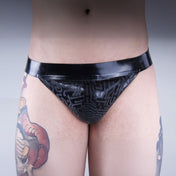 Latex premium-latex etched-pattern ectched-print intimates lingerie underwear jockstrap jock-strap pullon pull-on circuit circuit-print bold sleek stylish supportive striking edgy electrifying fetish fetishwear fashion alt-fashion bdsm bdsm-gear kink kinky male masculine masc mens menswear guys dudes black