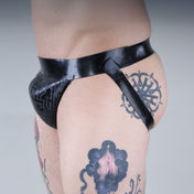 Latex premium-latex etched-pattern ectched-print intimates lingerie underwear jockstrap jock-strap pullon pull-on circuit circuit-print bold sleek stylish supportive striking edgy electrifying fetish fetishwear fashion alt-fashion bdsm bdsm-gear kink kinky male masculine masc mens menswear guys dudes black