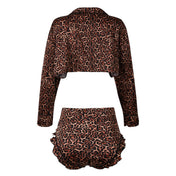 Spandex nylon satin apparel intimates lingerie lingerie-set loungewear 2-piece two-piece 2pc crop-top long-sleeve sleeves sleeved lapels bottoms shorts hipster ruffled ruched front-tie elastic-waistband breathable lightweight stretchy smooth soft luxurious sexy supple playful glossy airy skimpy flowing female femme feminine womens leopard-print 