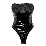 PVC vinyl polyester PU faux-leather patent-leather apparel tops one-piece onesie bodysuit sleeveless strapless cleavage roses big-roses studs studded dome-studs zipper back-zip hidden-zip half-zip high-leg snap-crotch snap-button shiny glossy unique edgy fetish fashion alt-fashion alternative punk goth gothic goth-doll rock pop-star costume cosplay halloween halloween-costumes female femme feminine womens black