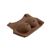 Silicone breastplate breast-plate breast-enhancements vest wearable lifelike realistic breasts tits titties boobs boobies fake simulated nipples yielding soft comfortable confidence drag dragqueen drag-queen gender-affirming transgender trans cross-dressing gender non-conforming gender-nonconforming gender-play nipple-play gender-x genderx kink kinky kinky-play bdsm C-cup mocha