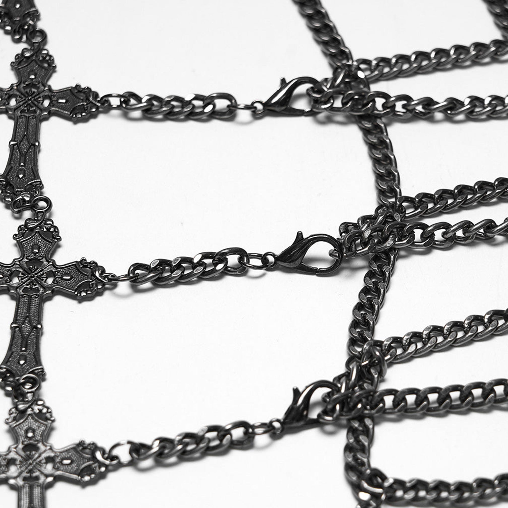 Aluminum-alloy iron chains metallic-chain apparel accessories skirt mini-skirt harness body-harness waist-harness cage-skirt hollow-cage tassels carved-crosses cross-chain adjustable closure lobster-clasp versatile textured comfortable subversive fierce slim-fit secure flexible stylish sleek edgy movement flair fetish fashion alt-fashion alternative punk rock goth gothic festival renfaire renaissance vintage costume cosplay halloween afterdark-collection female femme feminine womens black