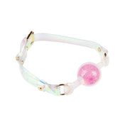 Silicone platinum-silicone PVC vinyl transparent seethru see-thru see-through accessories gag mouth-gag ball-gag adjustable buckle shiny sparkly sparkling playful reflective futuristic fetish fashion alt-fashion alternative bondage bdsm bdsm-play bdsm-gear bdsm-toys restraints kink kinky kinky-play kinky-toys unisex lgbtq pride hologram holographic iridescent pink