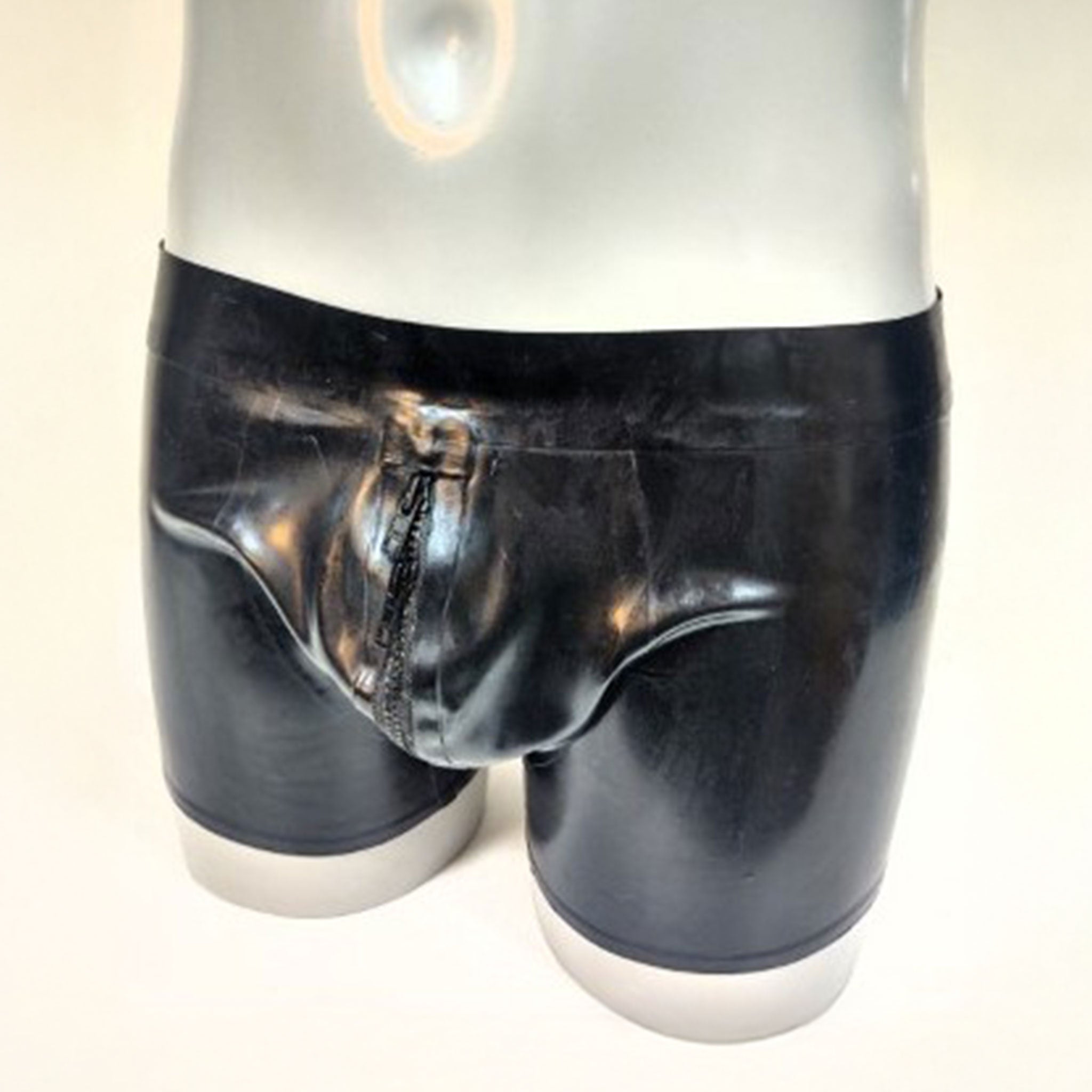 Latex rubber apparel bottoms shorts zipper front-zip waistband low-rise low-waist crotch-pouch zip-pouch front-pouch chunky-zip shiny glossy easy-access fetish fashion alt-fashion kink kinky kinkwear bondage bdsm male masculine masc mens menswear guys dudes black