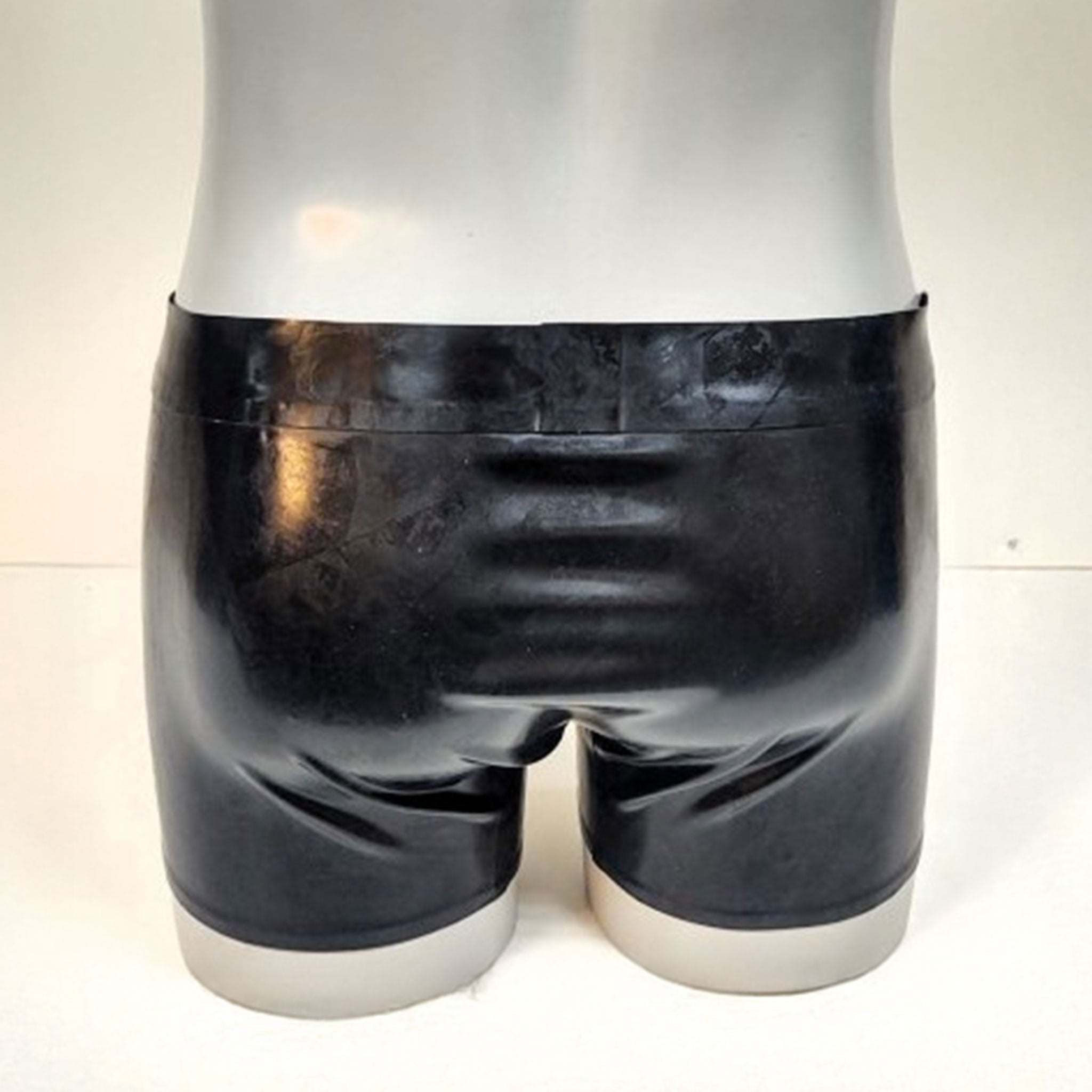 Latex rubber apparel bottoms shorts zipper front-zip waistband low-rise low-waist crotch-pouch zip-pouch front-pouch chunky-zip shiny glossy easy-access fetish fashion alt-fashion kink kinky kinkwear bondage bdsm male masculine masc mens menswear guys dudes black