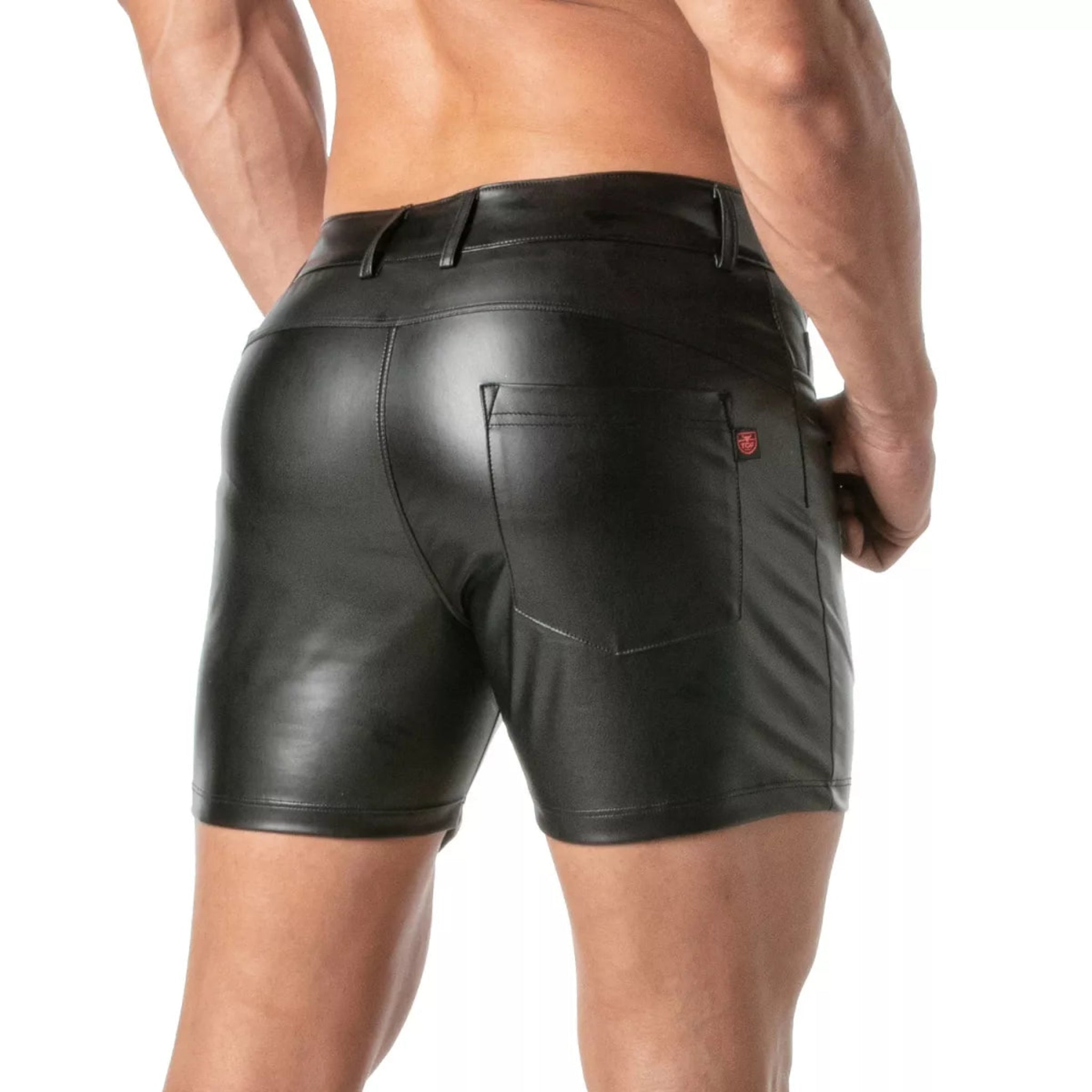 Black faux leather wetlook shorts, low-rise fit with suede lining, zip fly, and 4 pockets for a stylish fetish look.