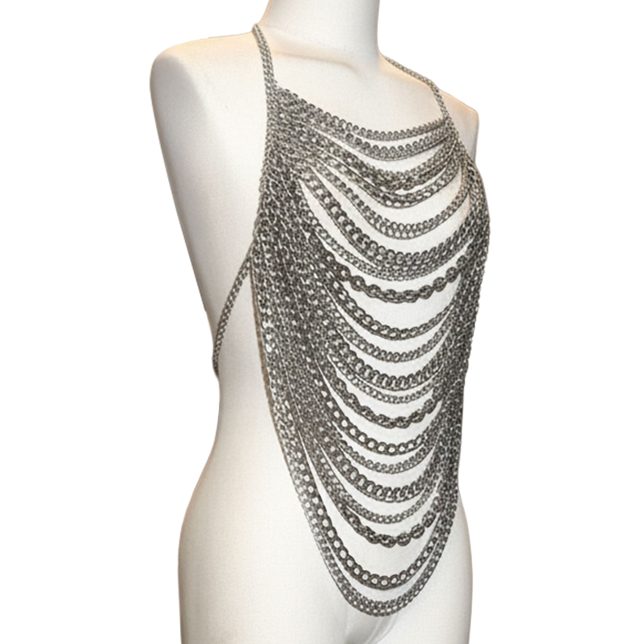 Metallic-chain cuban-link chainmail chain-mail mixed-chain hanging-chain draped-chain cable-chain apparel tops halter-top haltertop halter-dress croptop crop-top sleeveless adjustable lobster-clasp visual-movement edgy avant-garde fluid shiny sparkling bold architectural striking fetish fashion alt-fashion punk goth cyber gothic clubwear festivalwear costume cosplay halloween female femme feminine womens silver