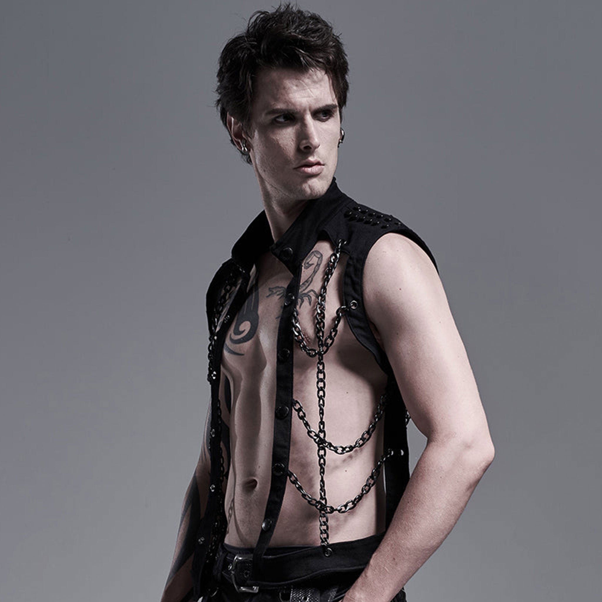 Cotton cotton-twill aluminum-chain apparel tops outerwear vest sleeveless high-collar mandarin-collar studded-shoulders hollowed-out hollow-vest wide-grid hanging-chains button-up button-down front-closure press-stud snap-button stretchy elastic soft rustproof rust-proof matte-glossy fetish fashion alt-fashion punk goth gothic cyberpunk steampunk industrial kink kinky kinkwear costume cosplay halloween halloween-costumes afterdark male masculine masc mens guys dudes black