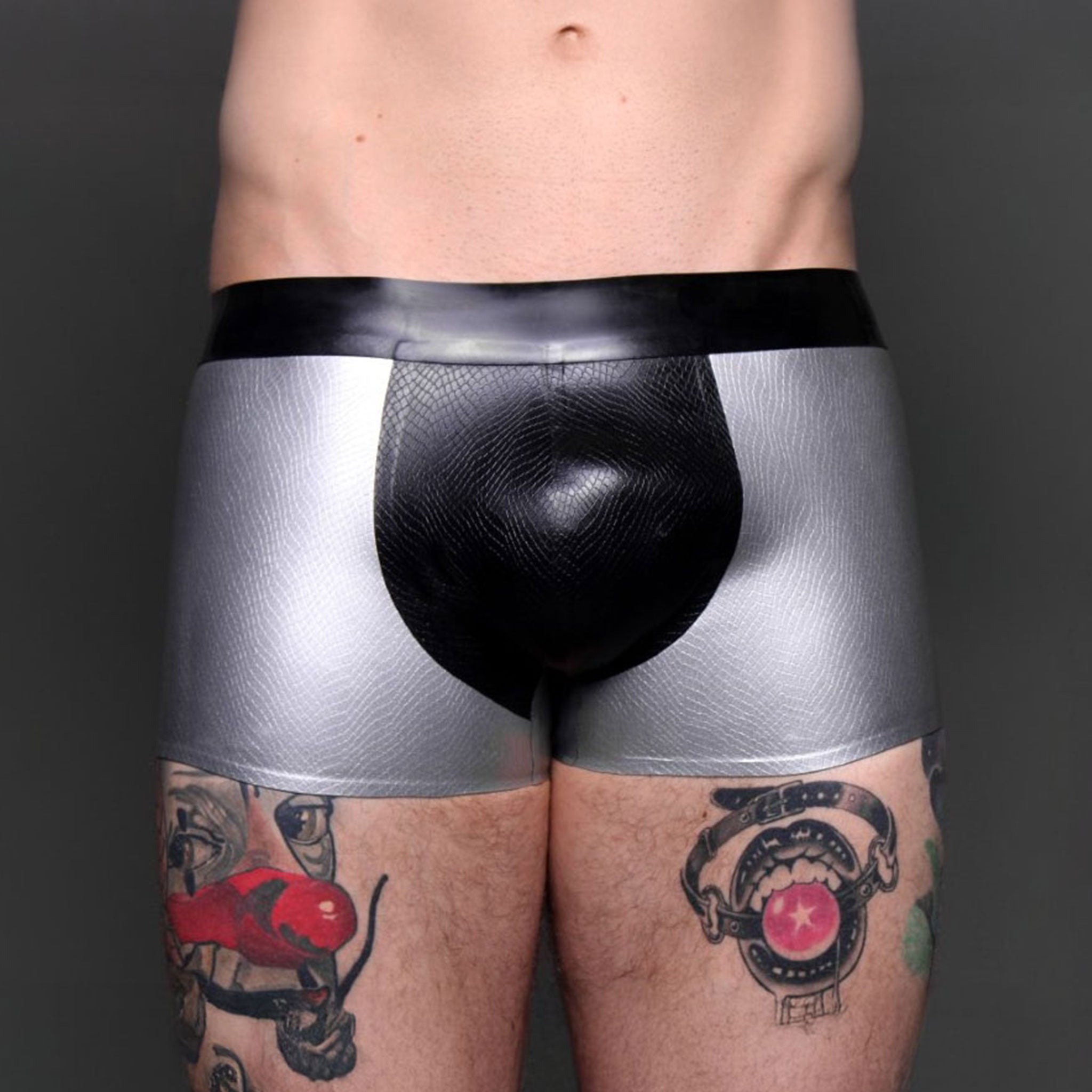 Latex rubber apparel bottoms shorts underwear etched-pattern snake reptile snakeskin textured scaly front-pouch crotch-pouch low-rise waistband two-tone contrast snug-fit comfortable sexy shiny slippery sleek fetish fashion alt-fashion clubwear bondage bdsm kink kinky kinkwear sensory sensual tactile male masculine masc mens menswear guys dudes black silver metallic
