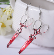 Bloody Scissor Earrings horror jewelry, dangling scissor design with blood-red accents, gothic accessories, bold statement earrings, perfect for Halloween and horror-themed looks.