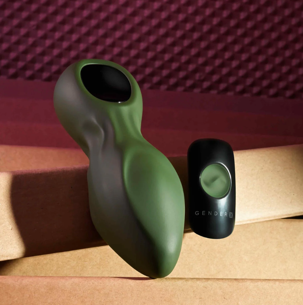 Green vibrating anal plug with 8 speeds and patterns, tapered tip for easy insertion, remote control with 30' range, USB rechargeable, waterproof, body-safe silicone.