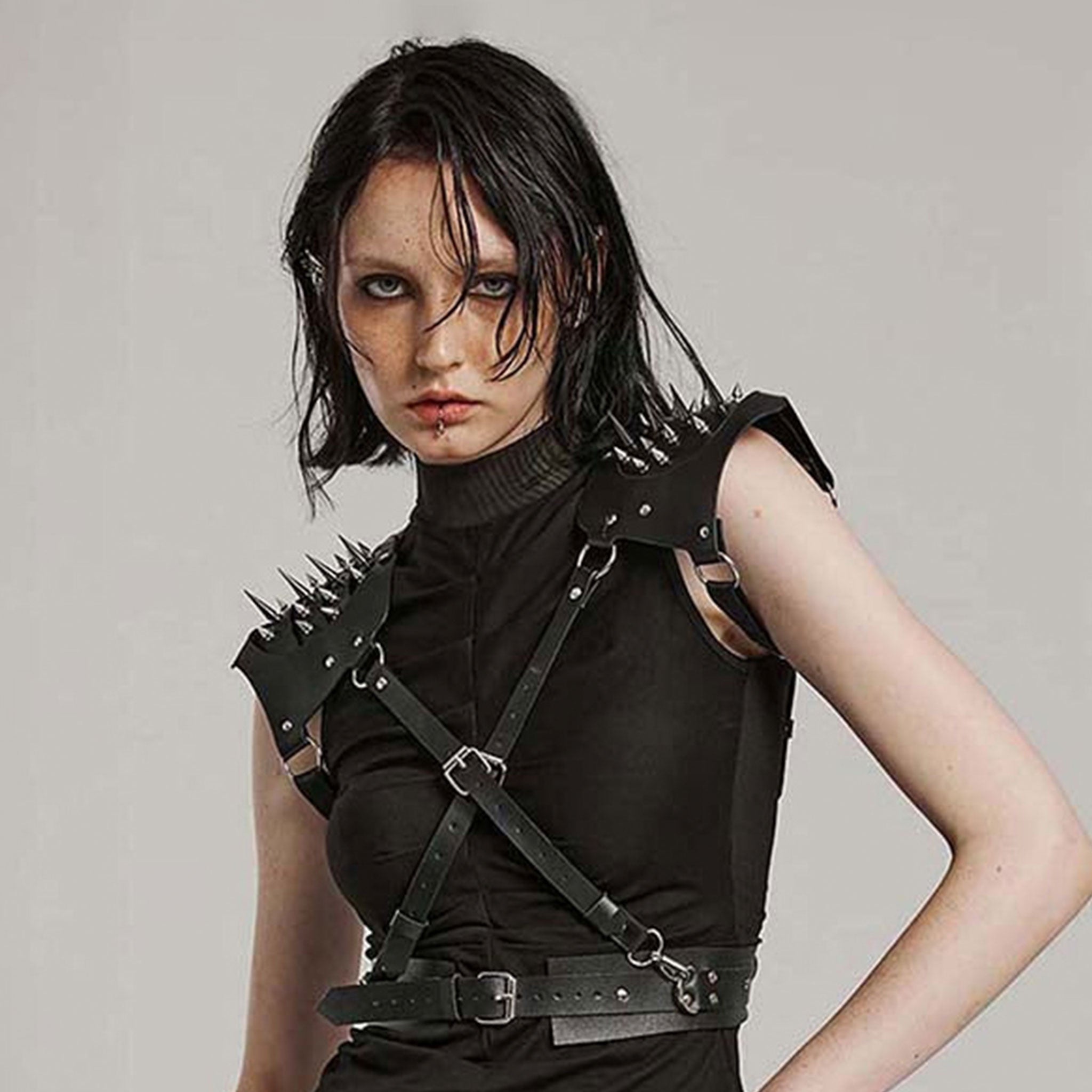 Leather faux-leather PU-leather microfiber accessories tops harness body-harness chest-harness shoulders shoulder-pads spike spiked spikes adjustable buckle armpit-straps spring-clip D-ring O-ring integrated bold rugged powerful edgy fierce fetish fashion alt-fashion goth gothic punk bdsm costume cosplay halloween couture armor post-apocalypse apocalypse road-warrior warrior unisex black