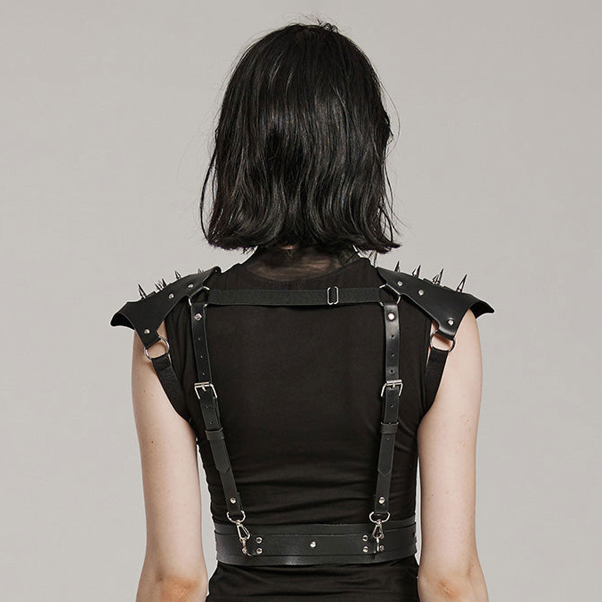 Leather faux-leather PU-leather microfiber accessories tops harness body-harness chest-harness shoulders shoulder-pads spike spiked spikes adjustable buckle armpit-straps spring-clip D-ring O-ring integrated bold rugged powerful edgy fierce fetish fashion alt-fashion goth gothic punk bdsm costume cosplay halloween couture armor post-apocalypse apocalypse road-warrior warrior unisex black