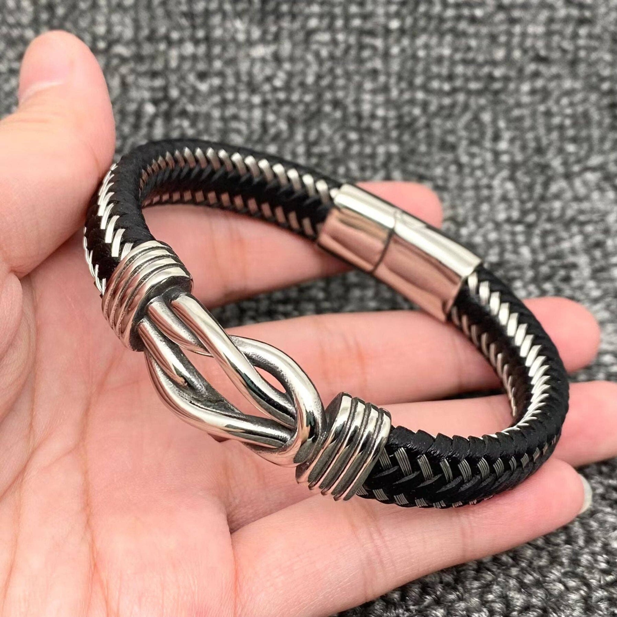Steel Leather Woven Unlimited Knot Bangle, stainless steel, PU leather, polished finish.