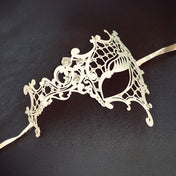 Metallic metalwork semi-flexible semi-malleable laser-cut rhinestones gems accessories mask eye-mask filigree-mask asymmetrical one-eye tie-on satin-ribbon elegant elegance sparkling luxury luxurious delicate graceful refined costumes cosplay Halloween masquerade masquerade-ball party bridal formal-ball winter winter-themed unisex white clear