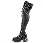 Vegan-leather patent-leather blended-leather footwear shoes boot thigh-high thigh-hi hanging-chains plated-heel chunky-heel screwed-in horseshoe-ring ball-caps buckle-straps eyelets lace-up laceup-front full-zip inside-zip zipper round-toe jingle fetish fashion alt-fashion punk rock goth gothic female femme feminine women black silver