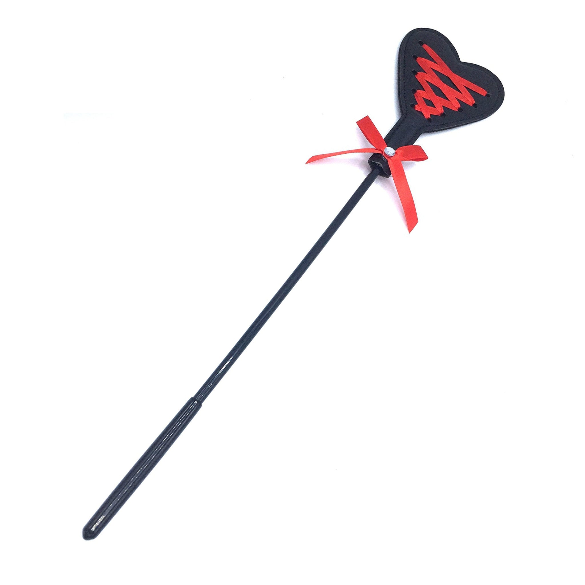 Heart riding crop, red ribbon corset design, BDSM whip, impact play toy, vegan leather crop, fetish gear, roleplay accessory.
