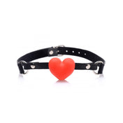 Frisky Heart Beat Silicone Heart Shaped Mouth Gag in red, featuring an adjustable strap and soft silicone heart for playful restraint.